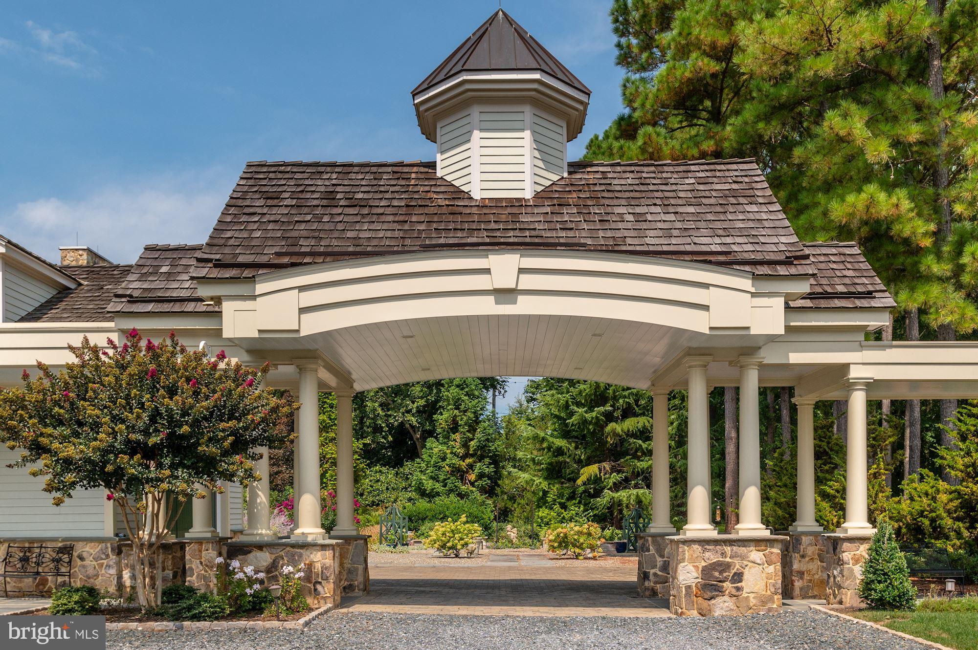 8620 Bozman Neavitt Road St. Michaels, MD 21663 - Photo 35 of 60 a front view of a house with garden