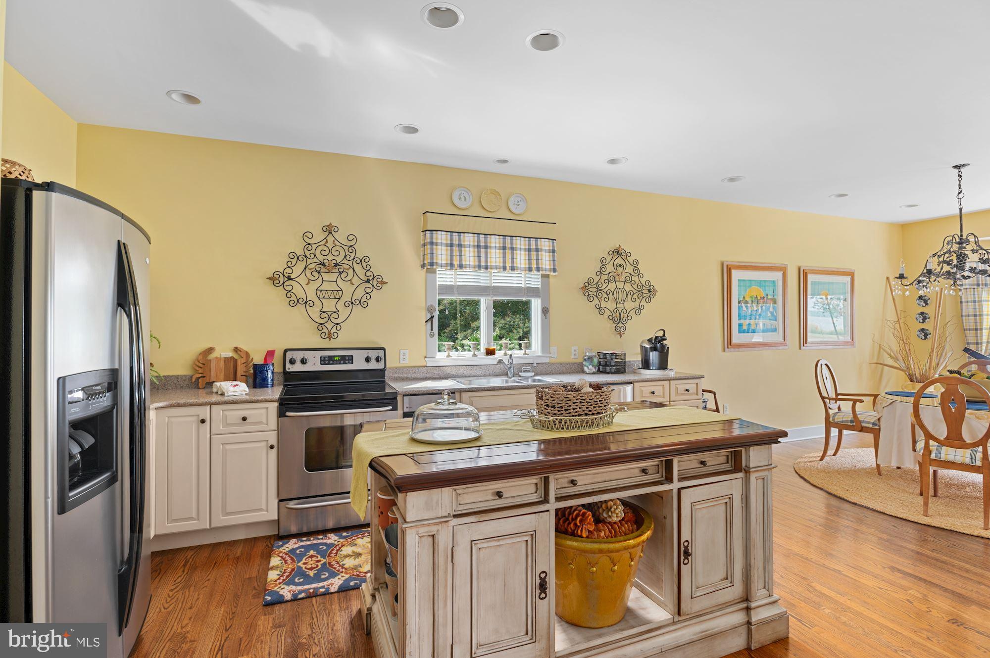 8620 Bozman Neavitt Road St. Michaels, MD 21663 - Photo 41 of 60 a view of a kitchen with stainless steel appliances granite countertop a stove and a refrigerator