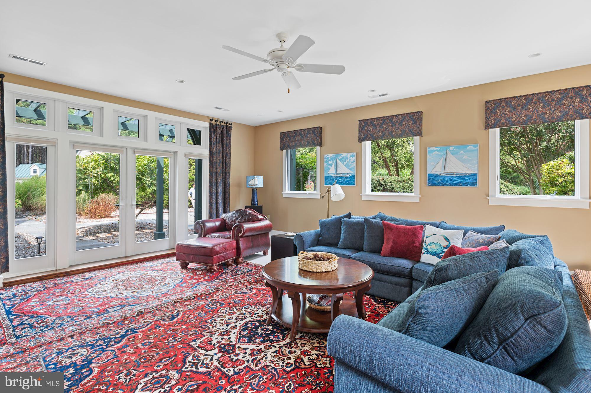 8620 Bozman Neavitt Road St. Michaels, MD 21663 - Photo 43 of 60 a living room with furniture and a large window