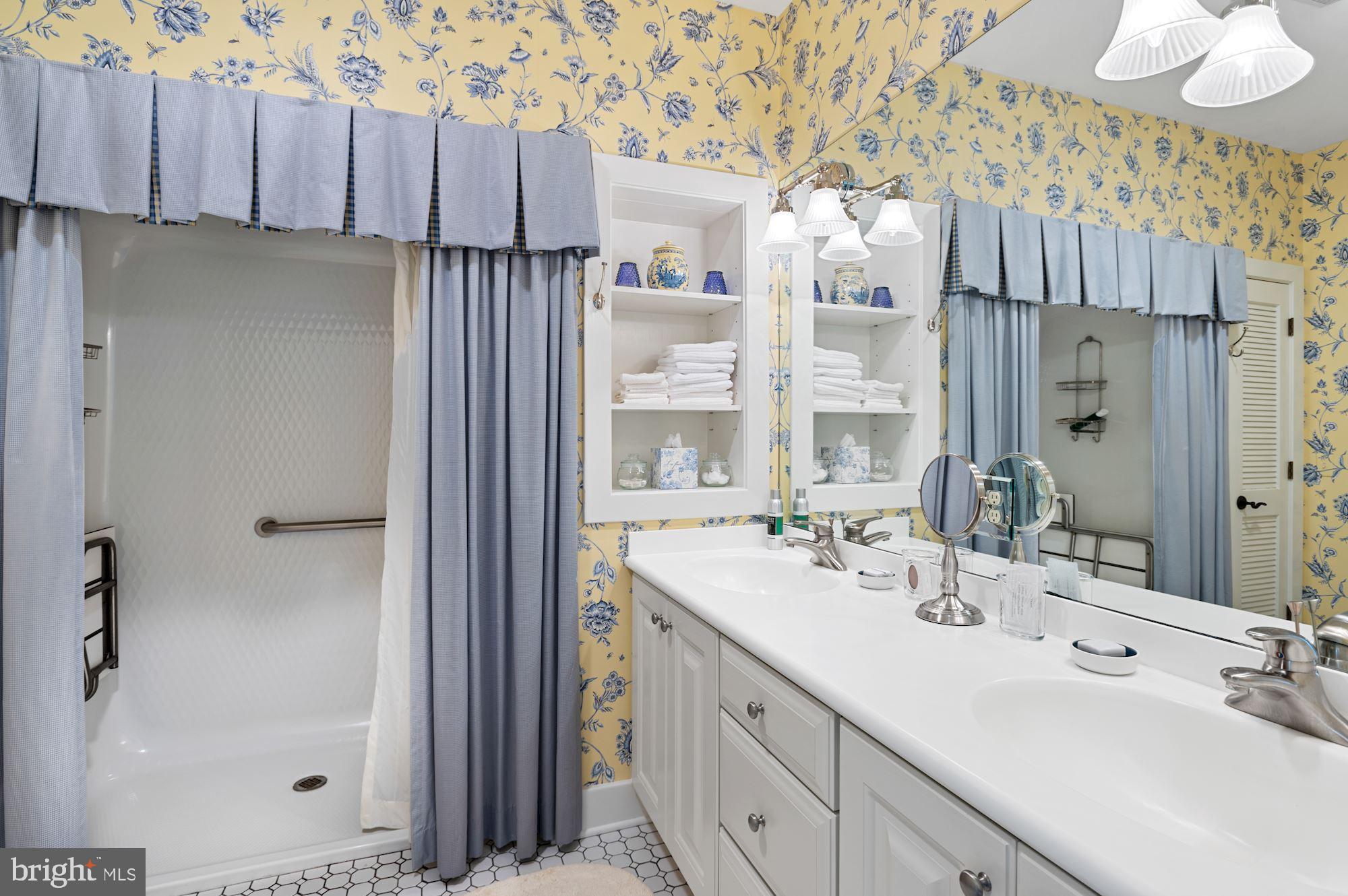 8620 Bozman Neavitt Road St. Michaels, MD 21663 - Photo 45 of 60 a bathroom with a double vanity sink mirror and double