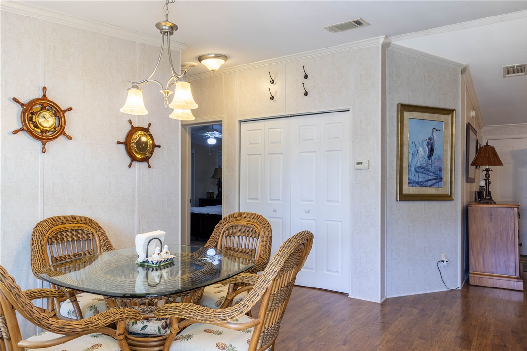 6171 98th Road Sebastian, FL 32958 - Photo 15 of 35 a dining room with furniture and wooden floor