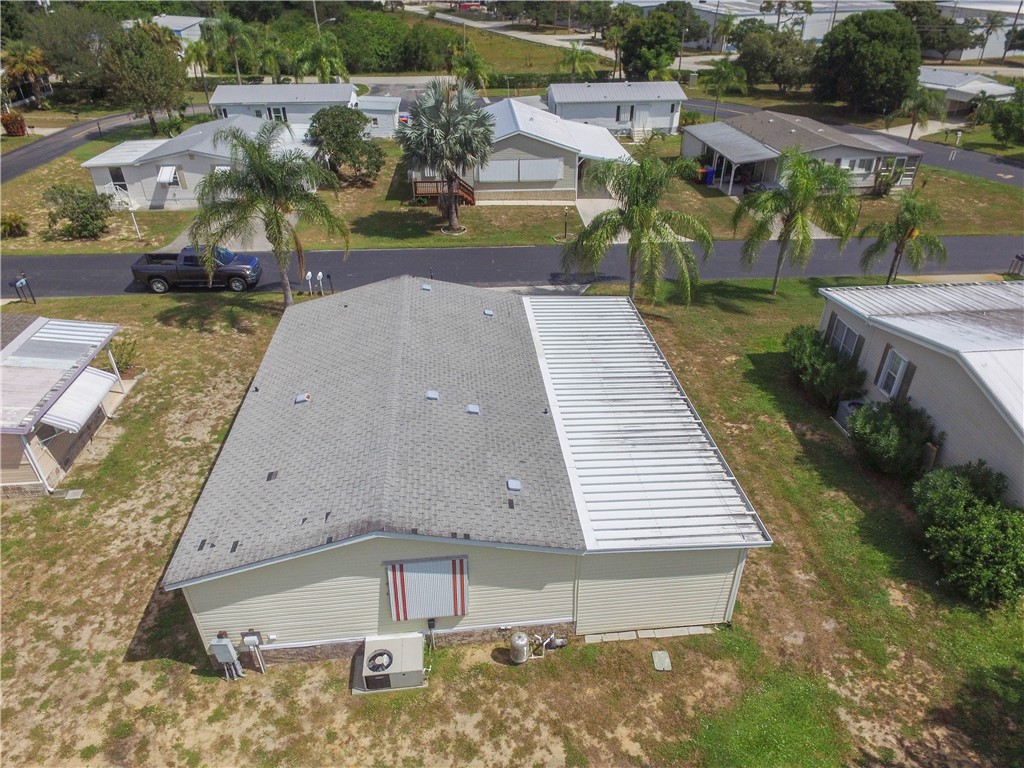 6171 98th Road Sebastian, FL 32958 - Photo 29 of 35 an aerial view of a house with a yard