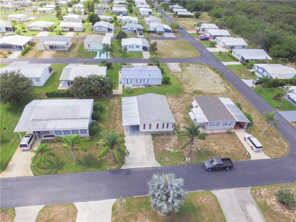 6171 98th Road Sebastian, FL 32958 - Photo 30 of 35 an aerial view of residential houses with outdoor space