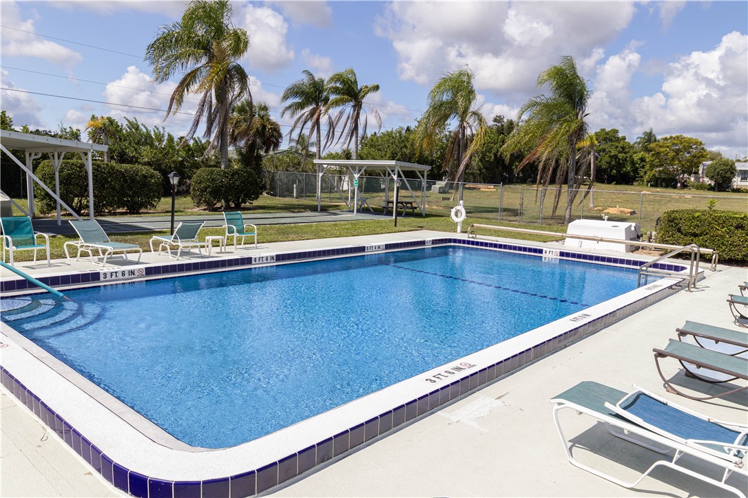 6171 98th Road Sebastian, FL 32958 - Photo 32 of 35 a view of swimming pool with chairs