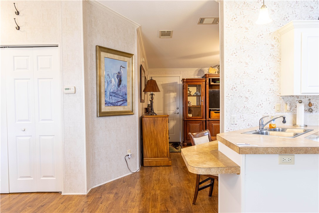 6171 98th Road Sebastian, FL 32958 - Photo 10 of 35 a view of a kitchen with a sink and breakfast area
