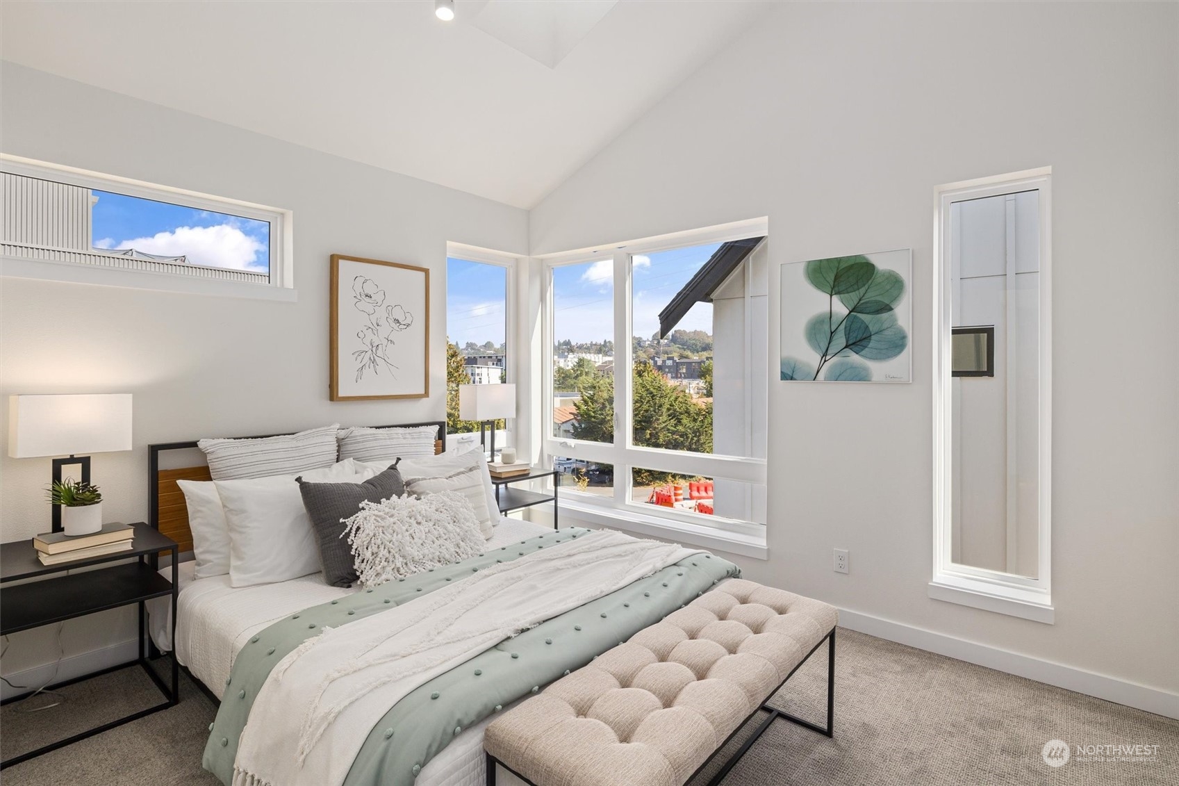 2203 22nd Avenue South Seattle, WA 98144 - Photo 13 of 21 a spacious bedroom with a bed a couch and a window