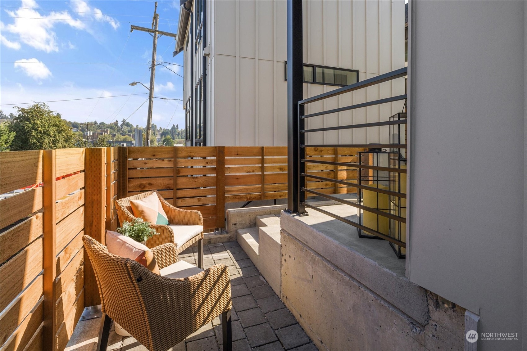 2203 22nd Avenue South Seattle, WA 98144 - Photo 3 of 21 a view of balcony with a couple of couches and potted plants