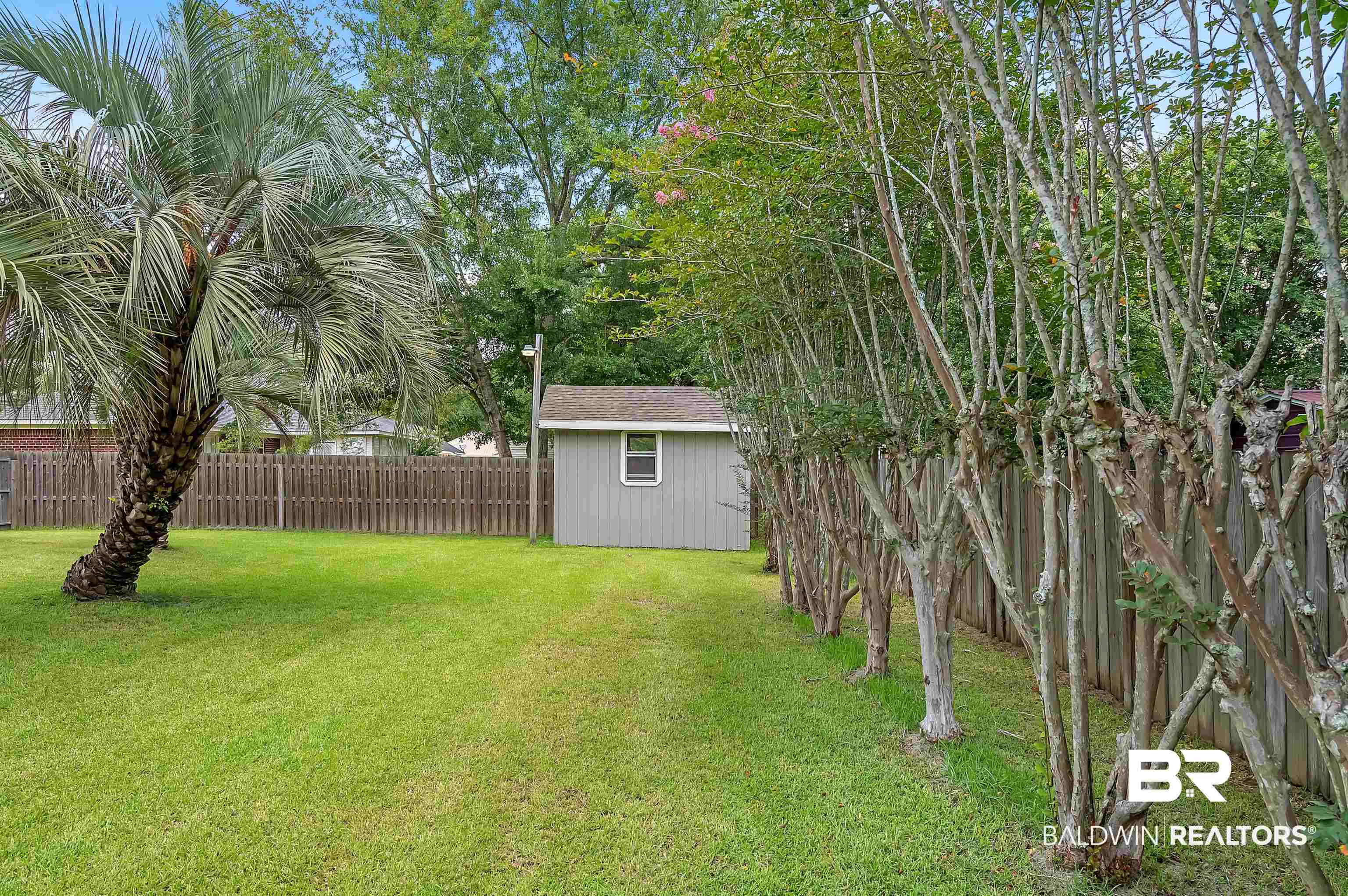 1502 Mulberry Lane Foley, AL 36535 - Photo 37 of 45 View of yard featuring a storage shed