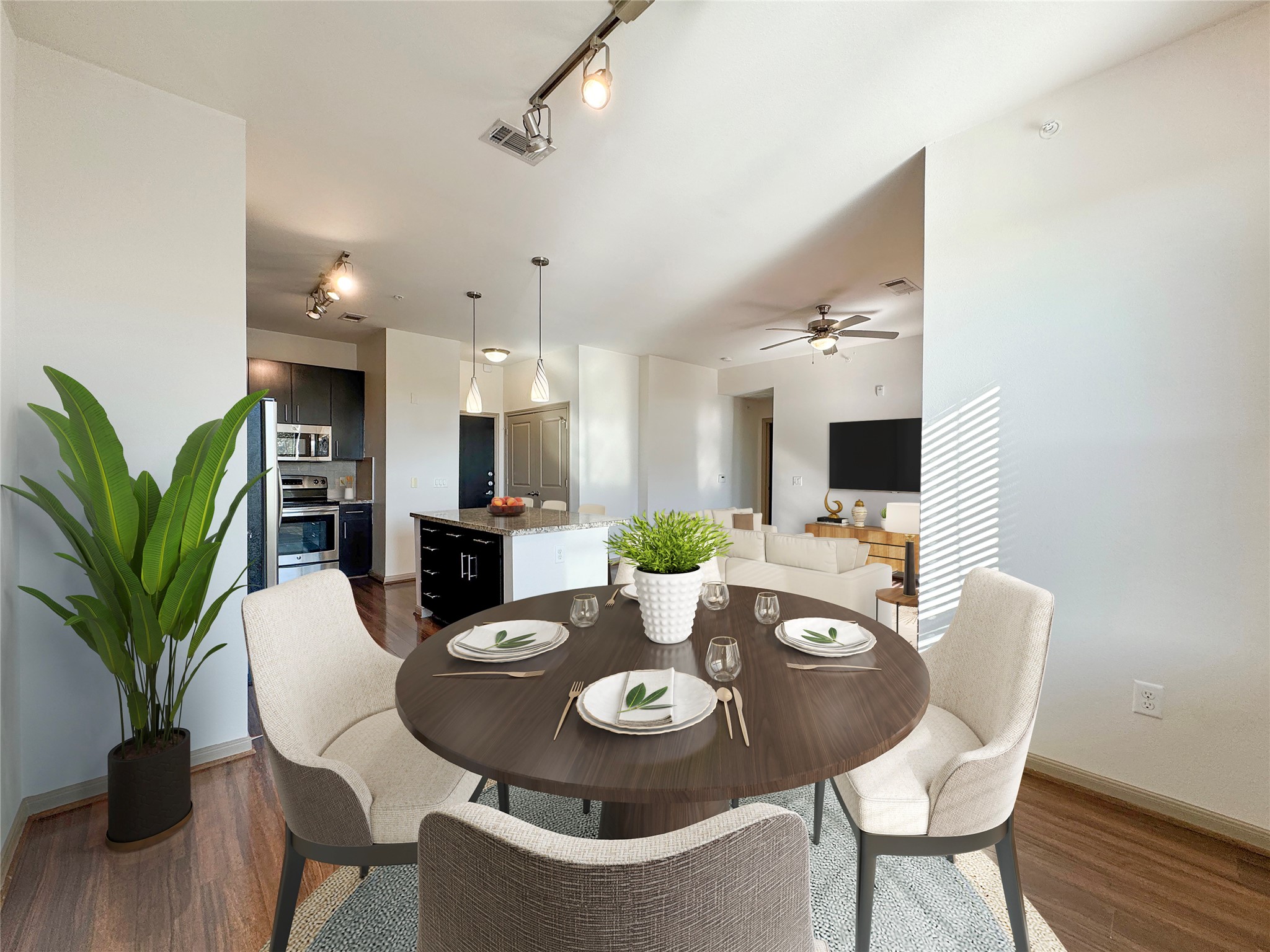 2700 Brazos Street, Unit 4303 Houston, TX 77006 - Photo 2 of 21 Open space between kitchen and living room. Stainless steel appliances and granite countertops with a dinning bar.