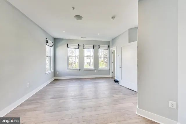 a bathroom with a double vanity sink toilet and a mirror