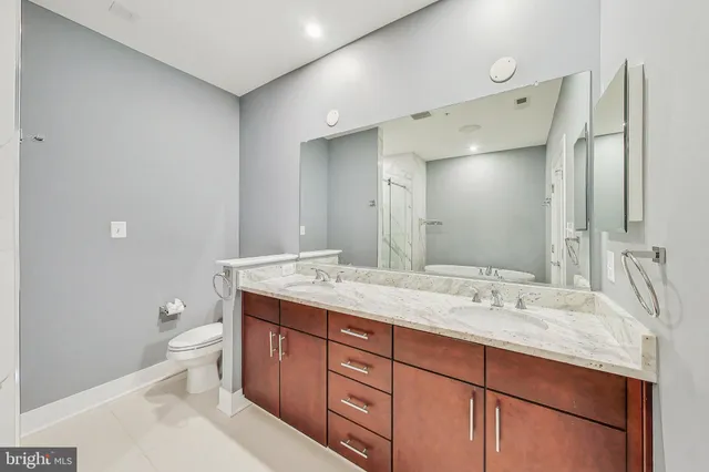a view of a room with wooden floor and a window