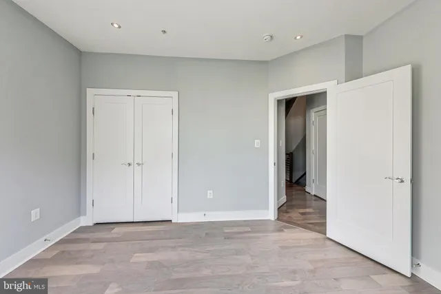a living room with a couch and a window