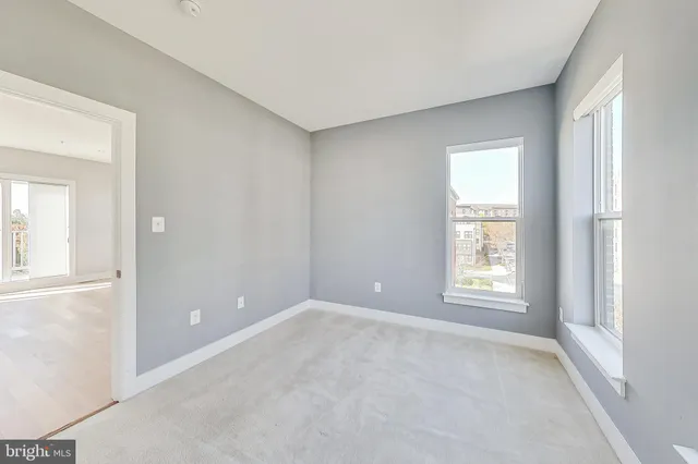 a view of a balcony with wooden floor and fence