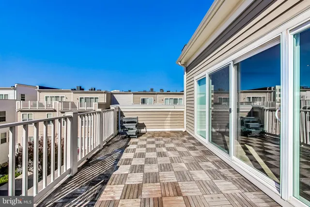 a front view of a building with trees