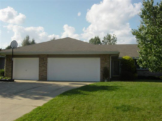 a front view of house with garden