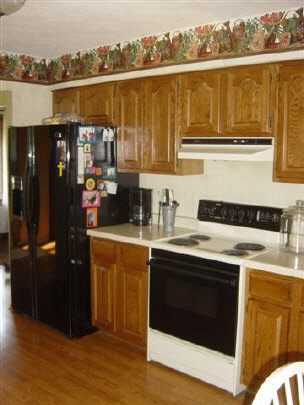 7148 Rye Ridge Trail Cherry Valley, IL 61016 - Photo 4 of 6 a kitchen with a stove and a microwave
