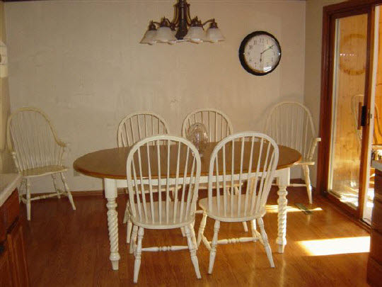 7148 Rye Ridge Trail Cherry Valley, IL 61016 - Photo 5 of 6 a view of a dining room with furniture and a chandelier
