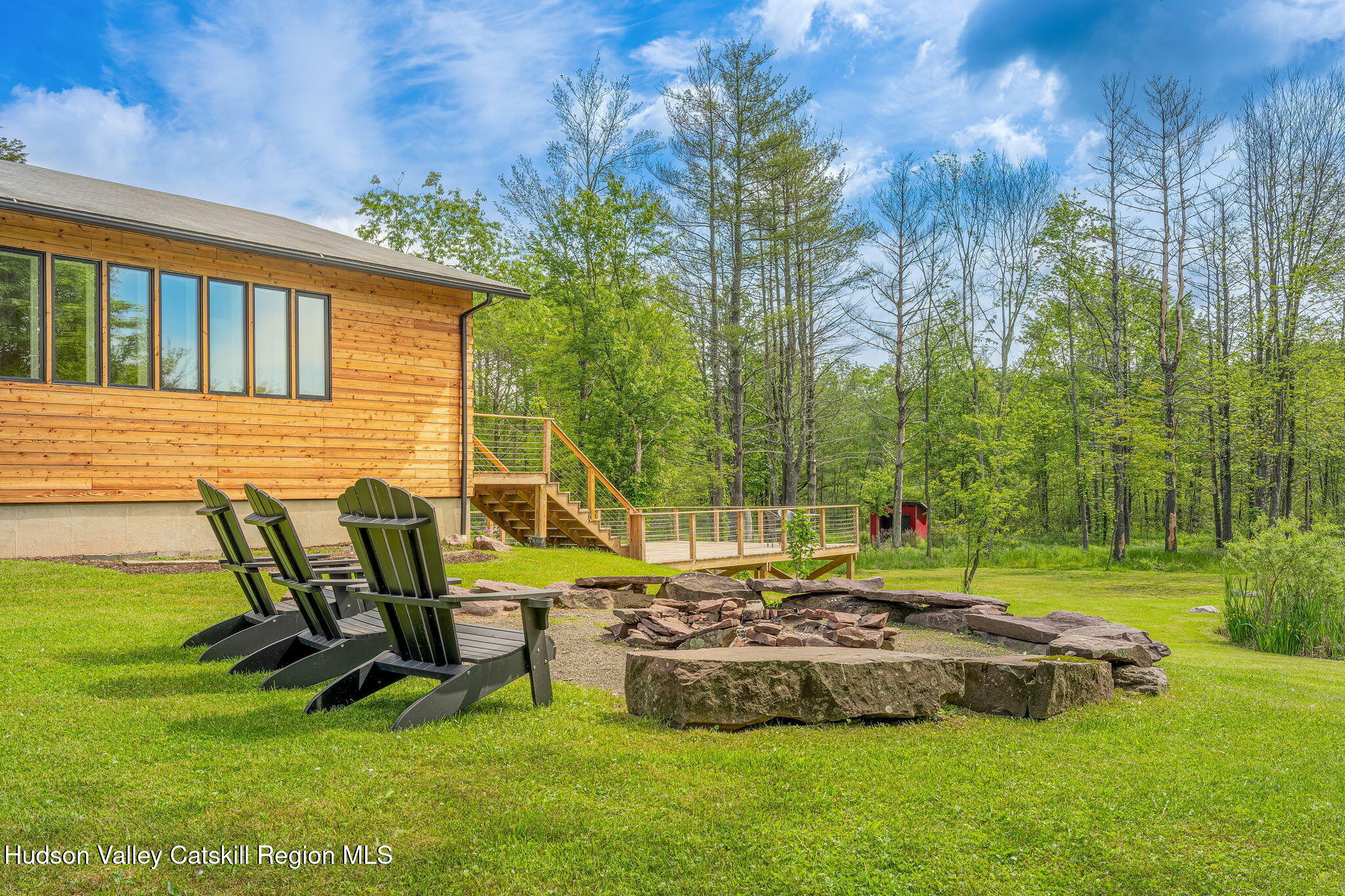 10 Harry Wells Road Saugerties, NY 12477 - Photo 19 of 58 a view of a backyard with sitting area and slide