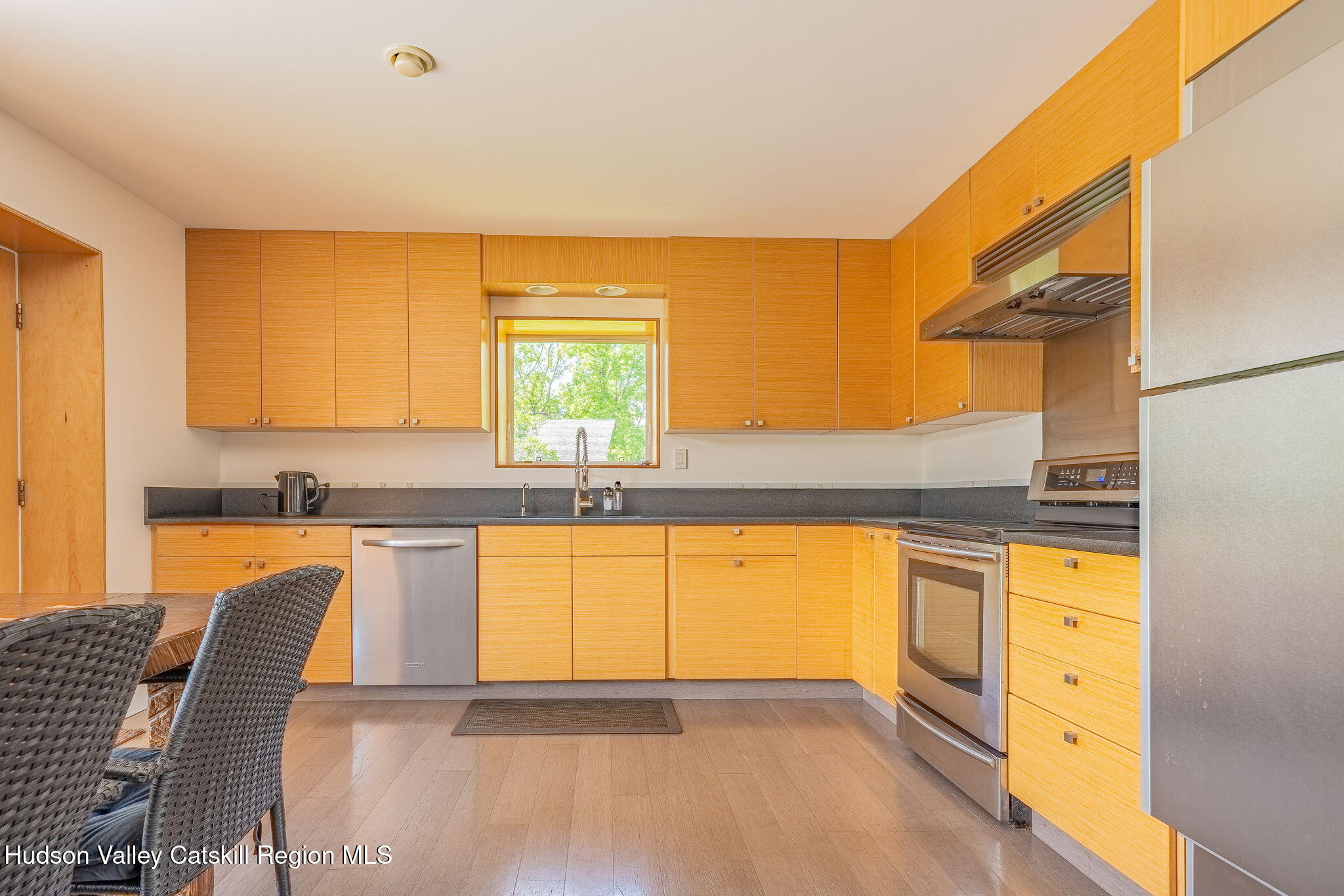 10 Harry Wells Road Saugerties, NY 12477 - Photo 33 of 58 a view of a kitchen with kitchen island granite countertop a sink and a large window