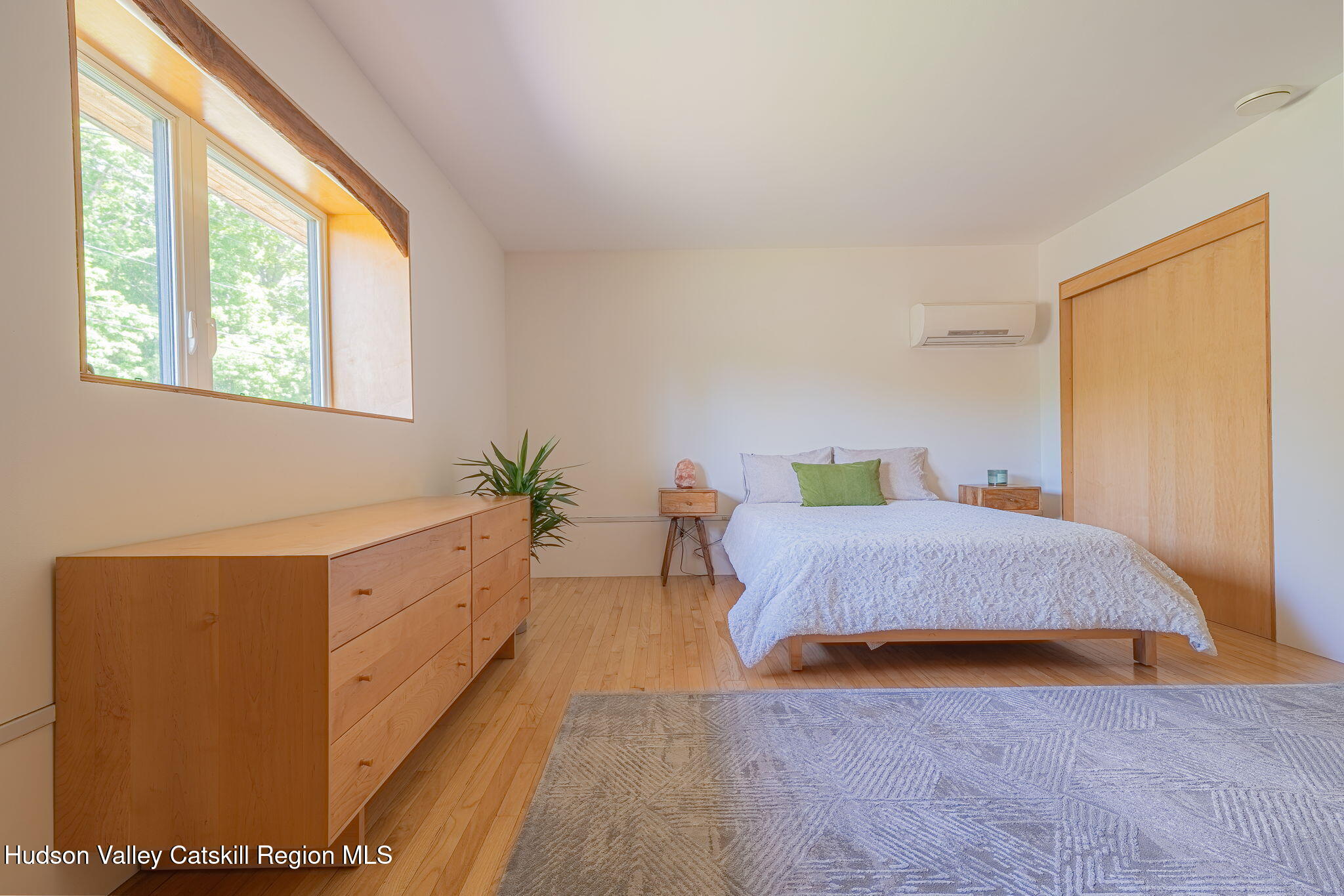 10 Harry Wells Road Saugerties, NY 12477 - Photo 36 of 58 a bedroom with wooden floor and a bed