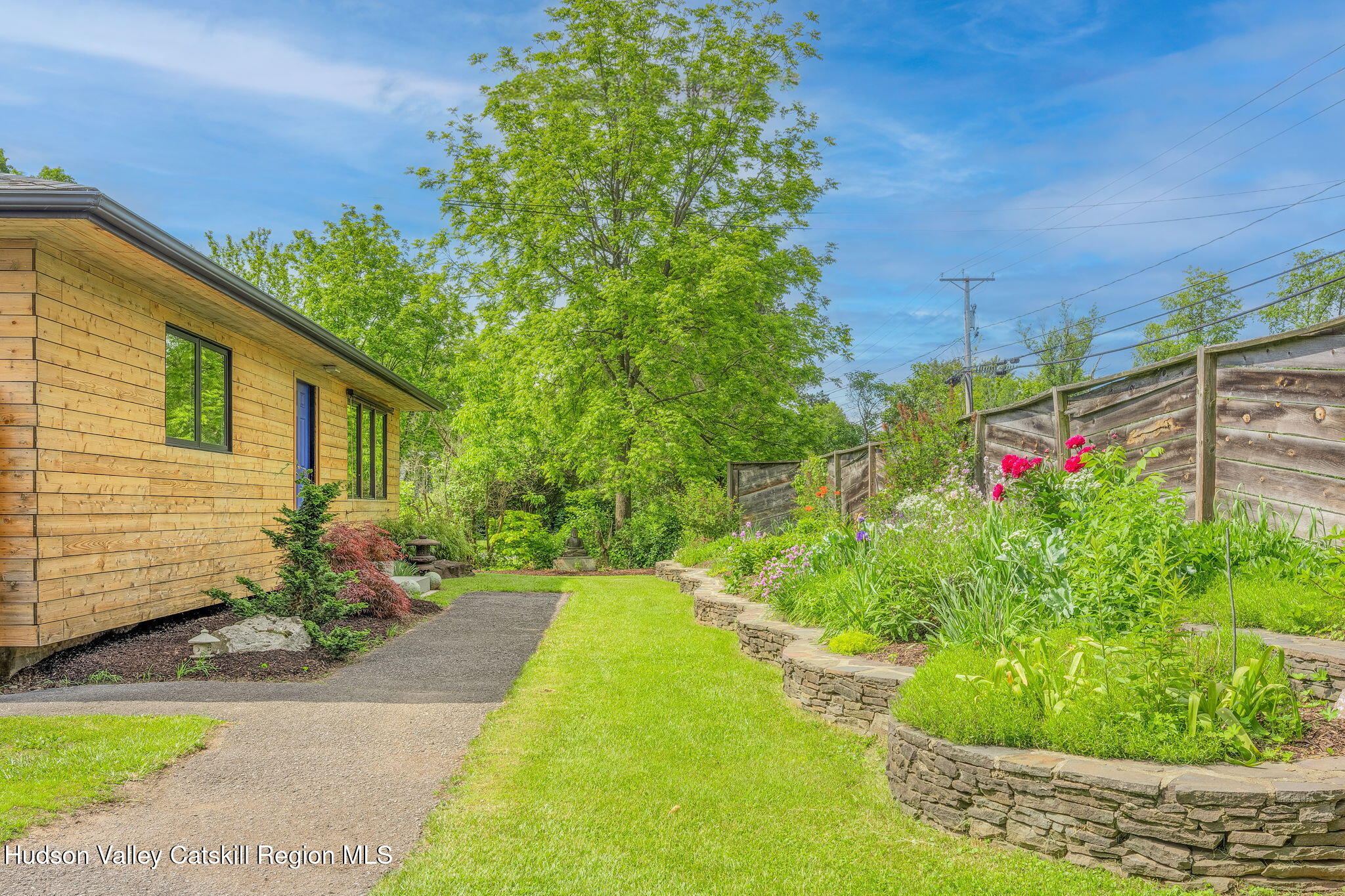 10 Harry Wells Road Saugerties, NY 12477 - Photo 46 of 58 a flower garden is sitting in front of a house