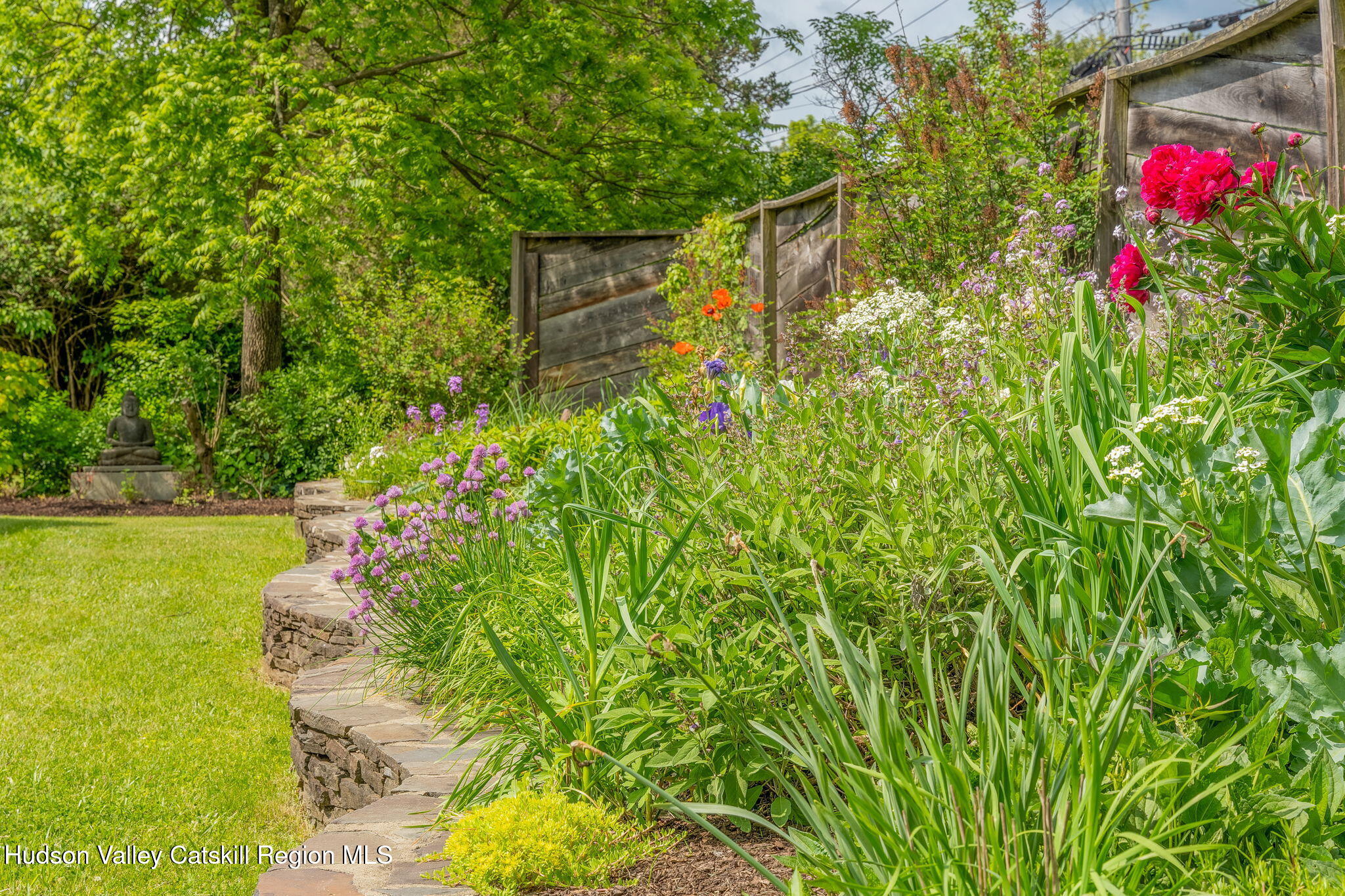 10 Harry Wells Road Saugerties, NY 12477 - Photo 56 of 58 a backyard of a house with lots of green space and bench
