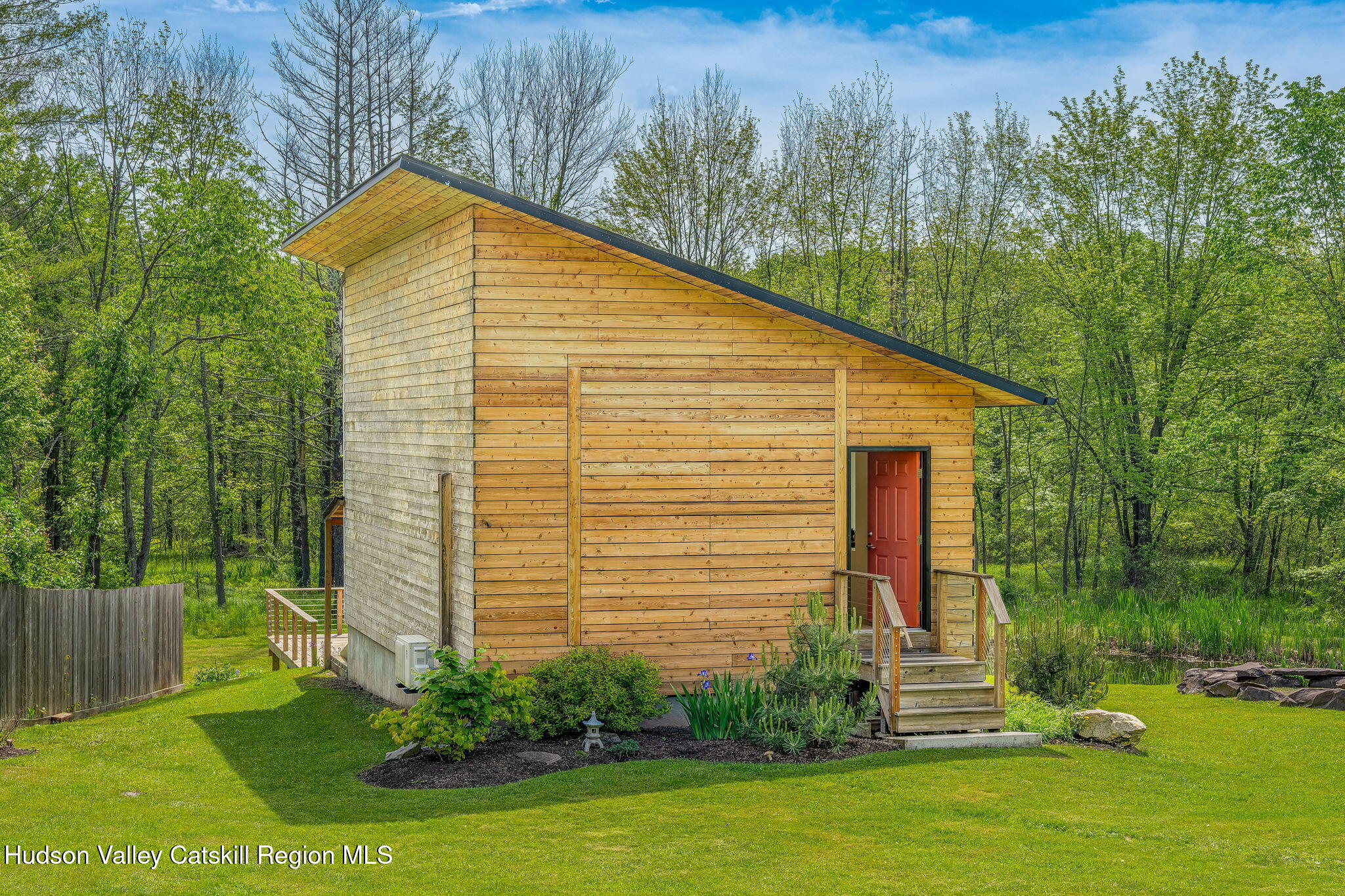 10 Harry Wells Road Saugerties, NY 12477 - Photo 9 of 58 a view of backyard with potted plants and large tree