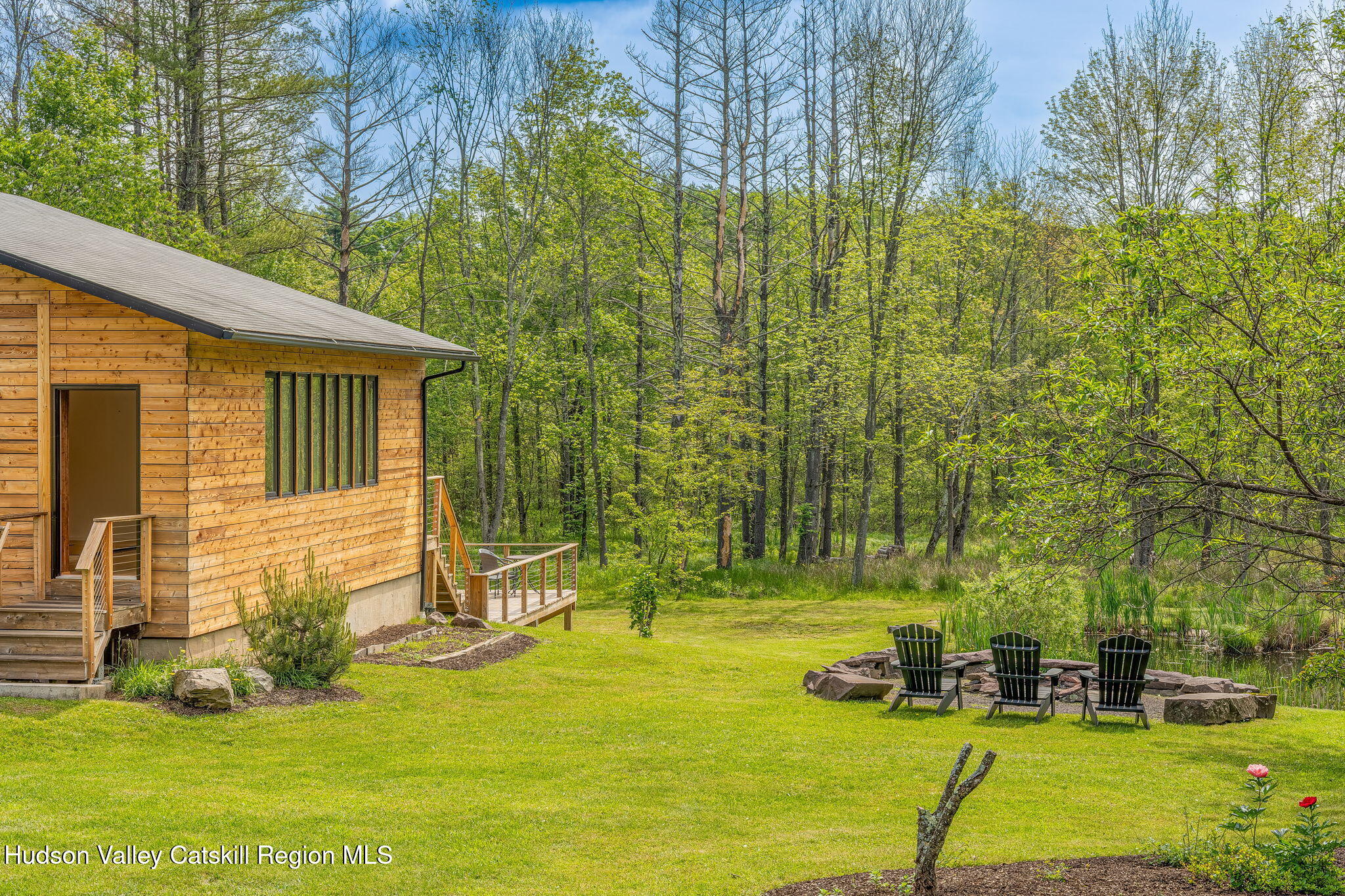 10 Harry Wells Road Saugerties, NY 12477 - Photo 10 of 58 a view of swimming pool with lawn chairs and large trees