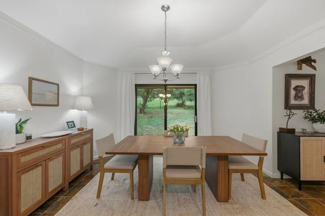 a view of a dining room with furniture window and outside view