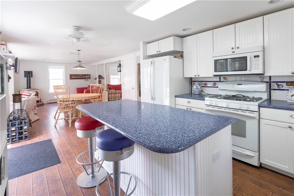 60 Lowells Cove Road Orrs Island, ME 04066 - Photo 9 of 27 The kitchen includes an island for...
