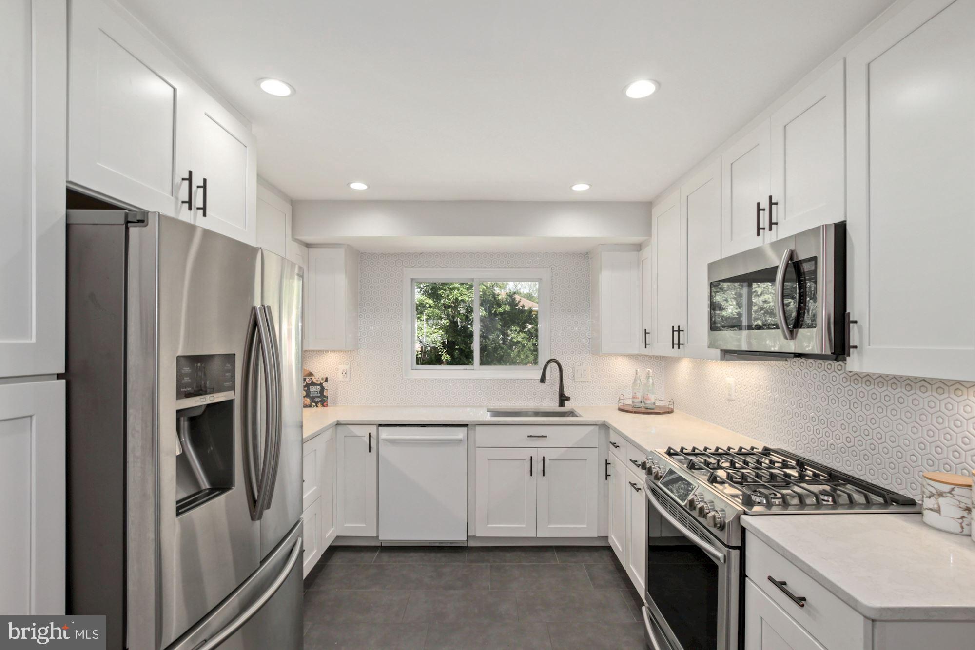407 Hannes Street Silver Spring, MD 20901 - Photo 17 of 31 Spacious and updated kitchen overlooking backyard