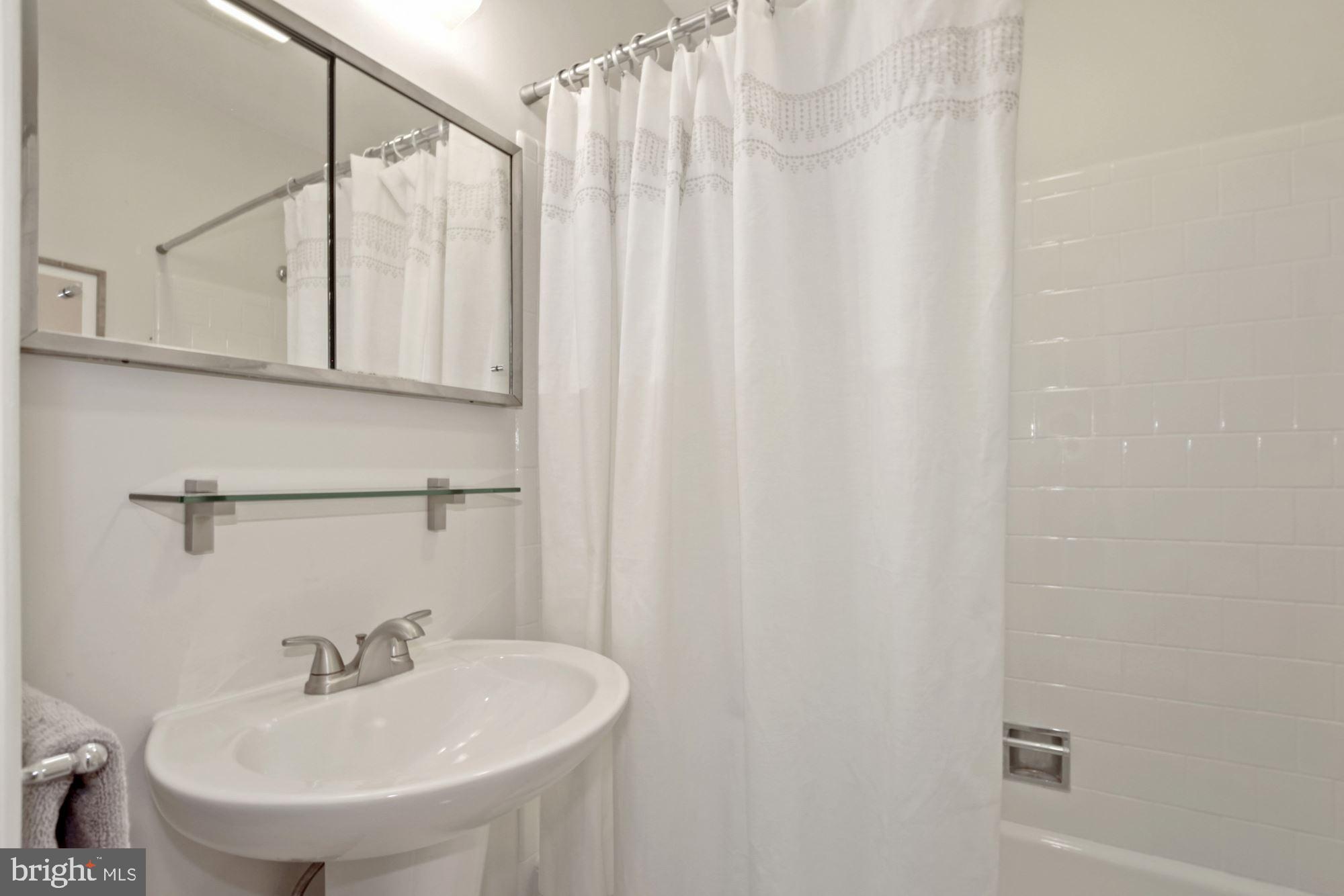 407 Hannes Street Silver Spring, MD 20901 - Photo 23 of 31 Updated hall bathroom on upper level