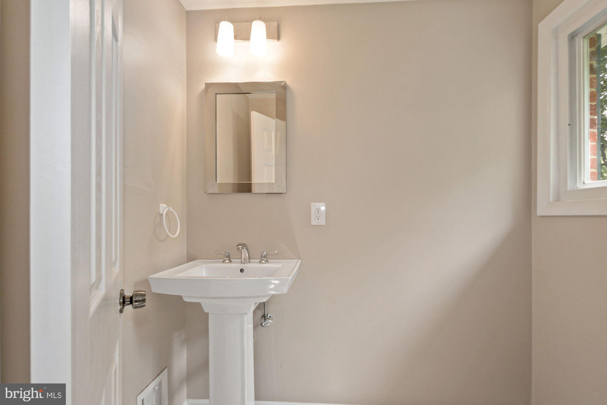 407 Hannes Street Silver Spring, MD 20901 - Photo 8 of 31 with an attached half bath!