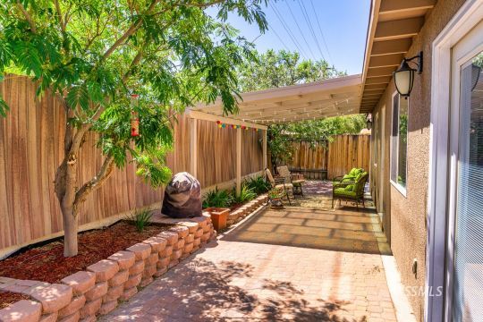 718 La Paloma Street Ridgecrest, CA 93555 - Photo 45 of 50 a backyard of a house with seating space