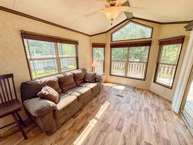 a view of a patio with table and chairs