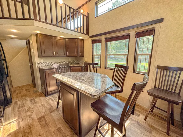 a bedroom with a bed next to a window