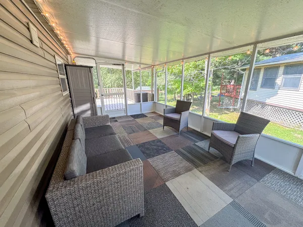 a view of a couch in wooden floor