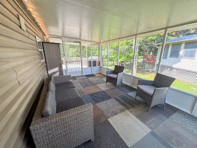 a view of a couch in wooden floor