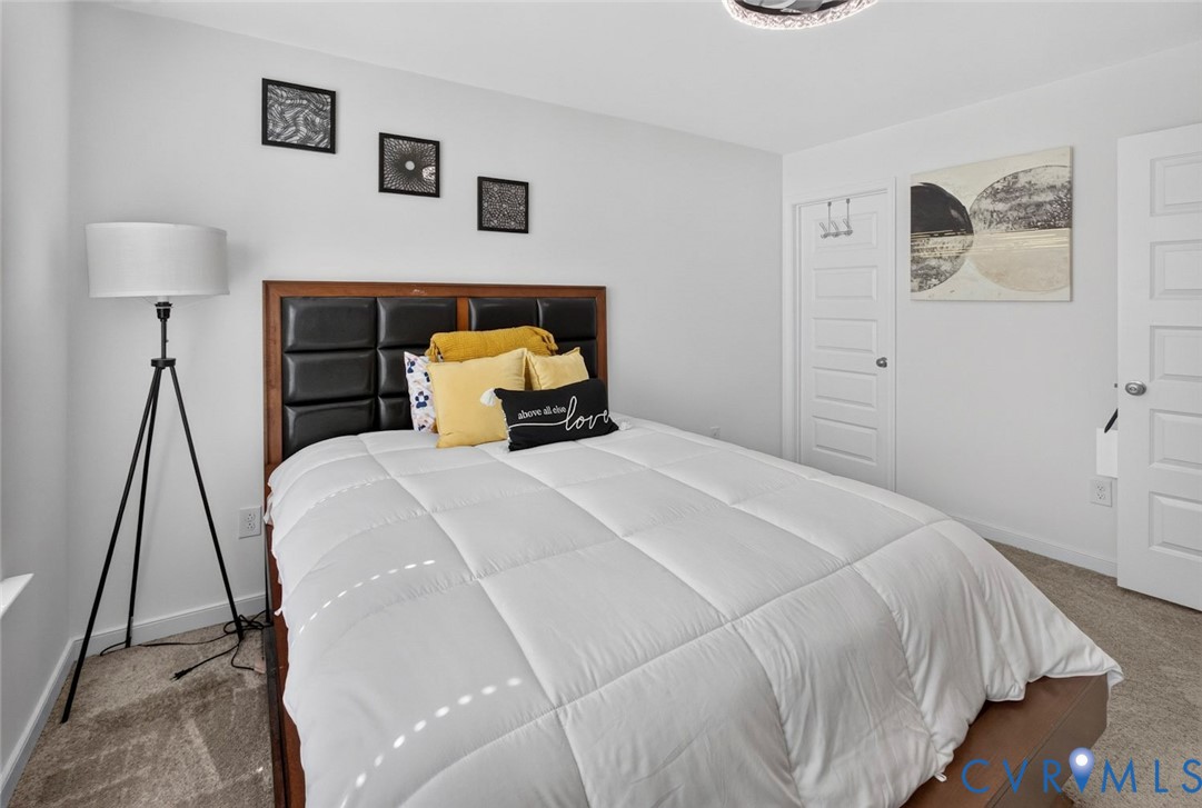 7507 Rouseaux Circle Chesterfield, VA 23832 - Photo 27 of 37 Neutral-toned carpeted flooring complements the li