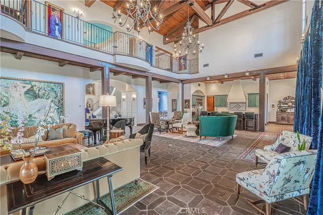 a view of a dining room with furniture wooden floor and chandelier