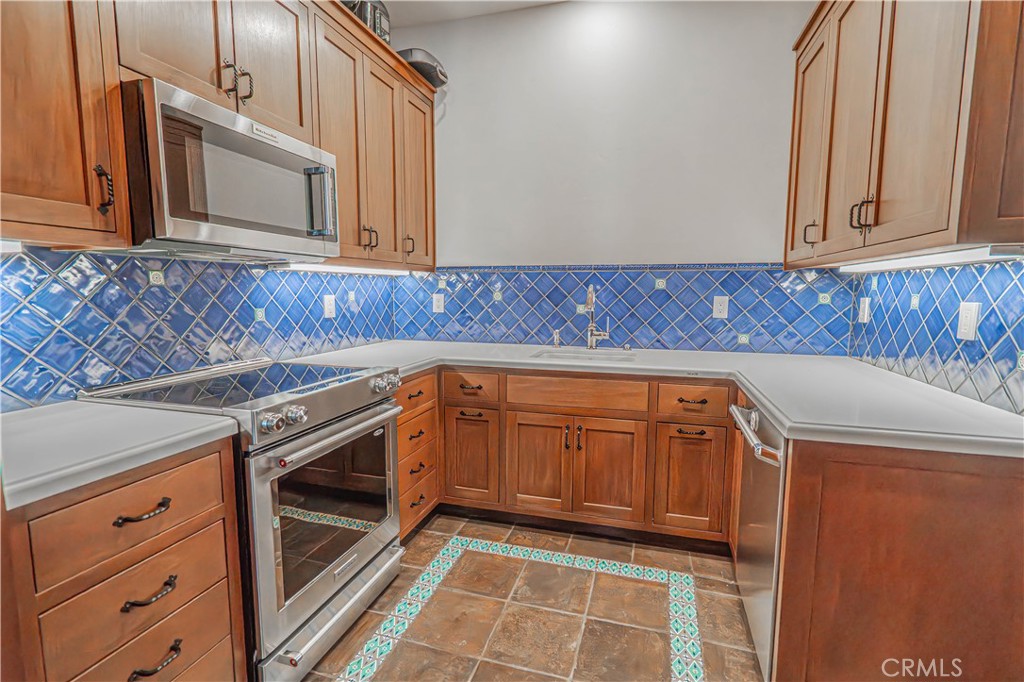 3030 Templeton Road Templeton, CA 93465 - Photo 17 of 75 a kitchen with granite countertop white cabinets and white appliances