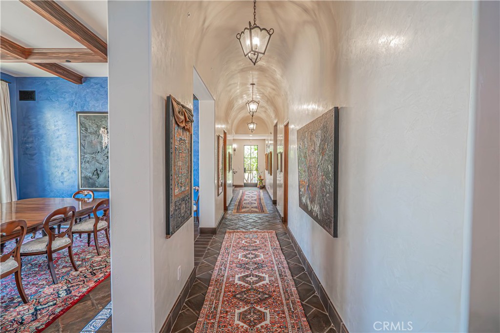 3030 Templeton Road Templeton, CA 93465 - Photo 19 of 75 Venetian plaster walls and barrel-vaulted ceilings line the hallway, adding a timeless architectural touch and elegant texture throughout.