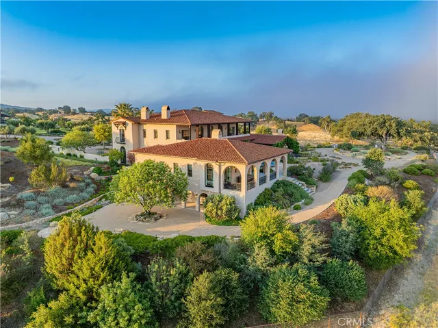 an aerial view of a house with a garden