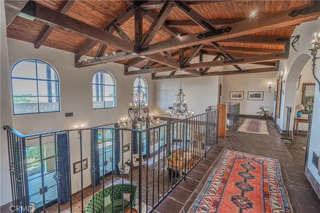 a view of a patio with table and chairs and potted plants