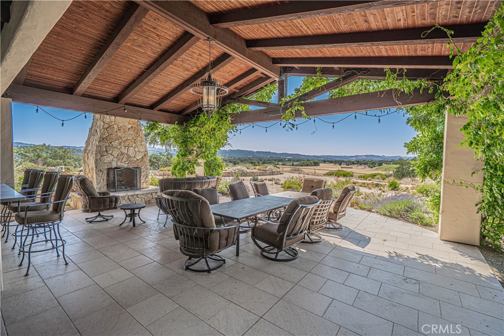 3030 Templeton Road Templeton, CA 93465 - Photo 28 of 75 a view of a patio with table and chairs and potted plants