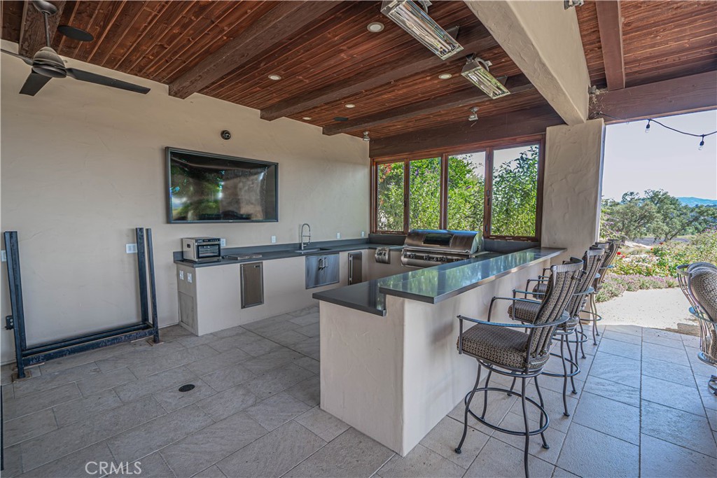 3030 Templeton Road Templeton, CA 93465 - Photo 30 of 75 a dining room with furniture a flat screen tv and floor to ceiling window