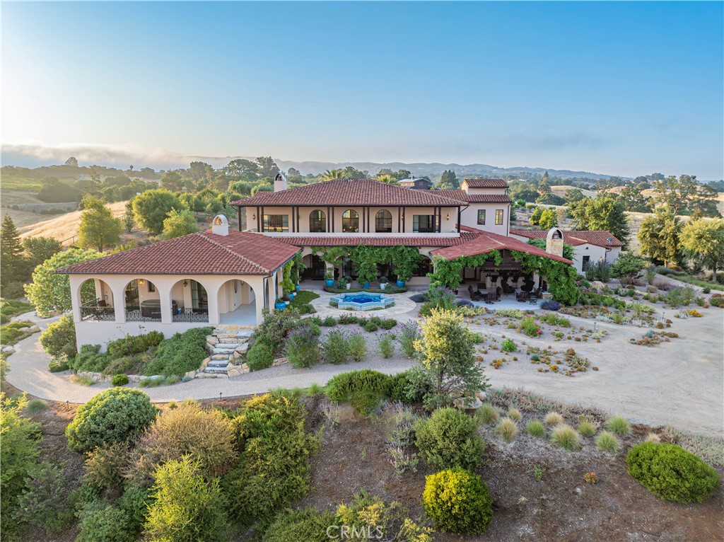 3030 Templeton Road Templeton, CA 93465 - Photo 3 of 75 Graceful arcades stretch along the back of the home, perfectly framing the breathtaking views beyond.