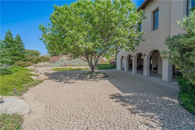 a view of a chairs and tables in patio of the house