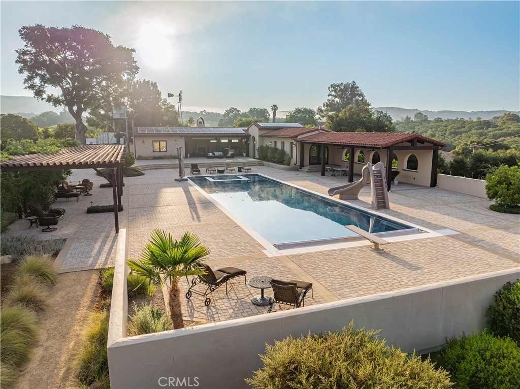 3030 Templeton Road Templeton, CA 93465 - Photo 43 of 75 a view of a swimming pool with outdoor seating and plants