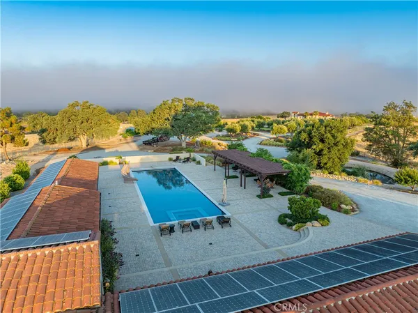 an aerial view of a house with outdoor space